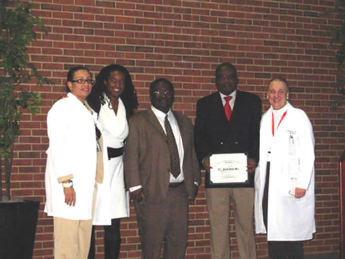 Dr. Bio with Drs. Aikens, Bachmann, Ayers and Larece.  Dr. Bachmann presented Dr. Bio with a Certificate of Recognition for his work in Global Health at the RWJUH OB/GYN Business meeting