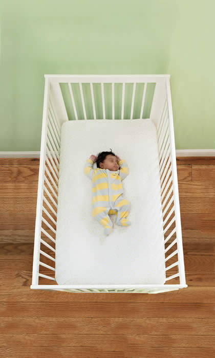 infant in safe crib environment