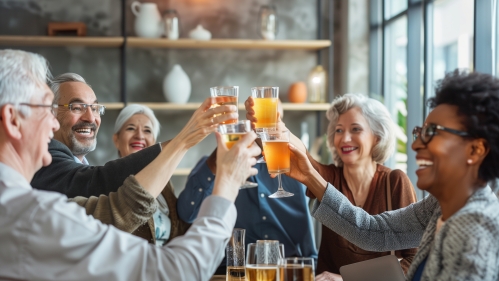Photo of people raising glasses to celebrate a coworkers retirement