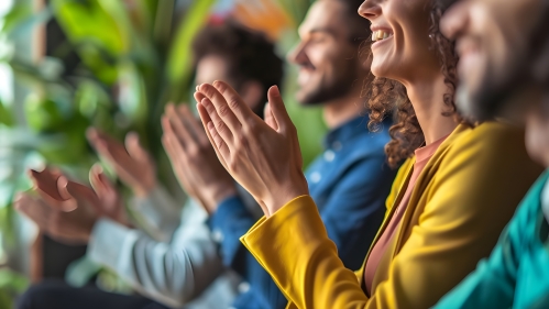 Photo of people clapping for another person