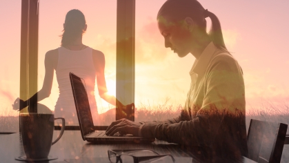 Image of woman working on laptop and doing yoga