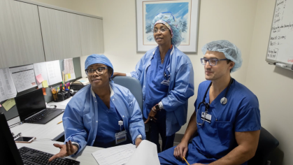 Three members of the anesthesiology team in scrubs.