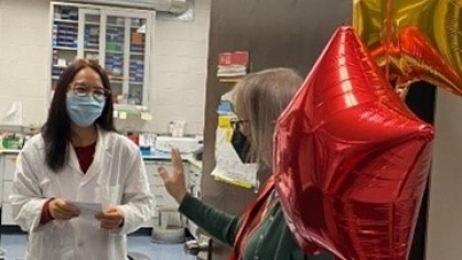 Image of Dr. Gelinas giving out Kind Bars for Kindness Day