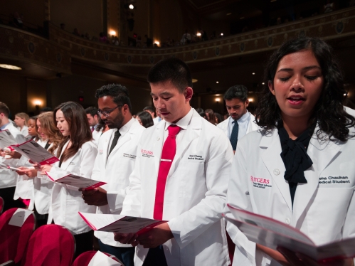 Students recite the hippocratic oath at the White Coat Ceremony