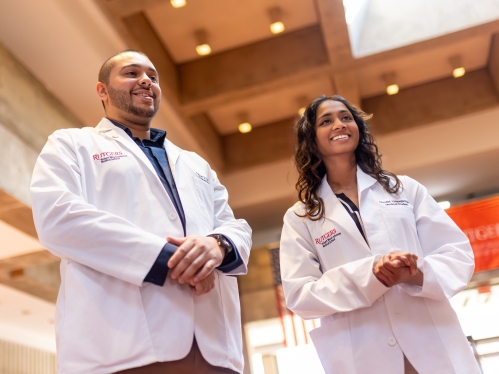 Two medical students smiling