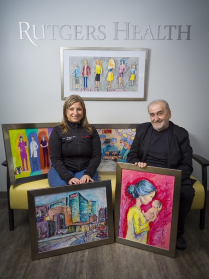 Lena Merjanian and her father pose with their artwork in the Rutgers Health practice lobby