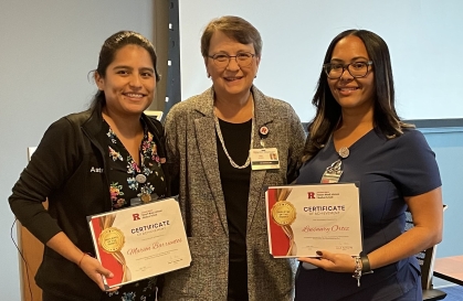 Photo of Dean Murtha presenting Employee of the Month Certificates to Marion Barrientos and Luisaury Ortiz