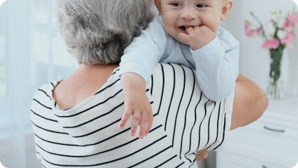 Image of granny holding an infant in her arms