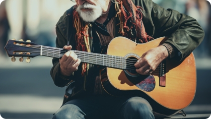 Image of senior man playing a guitar