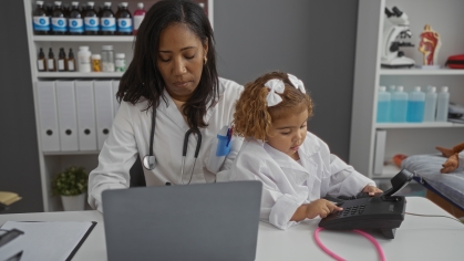 Image of researcher with child in lab