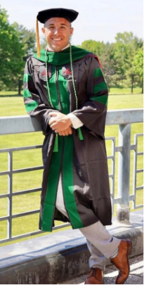 A graduate in cap and gown