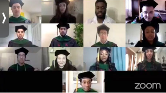 A group of graduates on a zoom call in caps and gowns at convocation during COVID