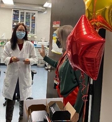 Image of Dr. Gelinas giving out Kind Bars for Kindness Day