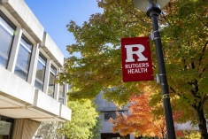 Image of Rutgers Health banner in front of a building