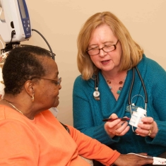Doctor chatting with patient; Photo courtesy of Parker Health Group