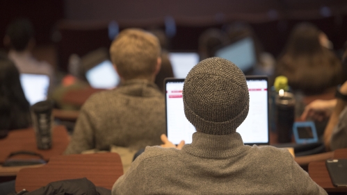Students with laptops in genetics class