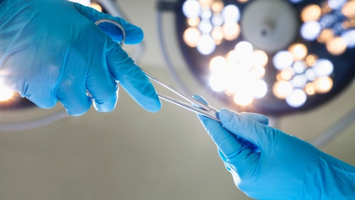 Hands holding Surgical Instruments